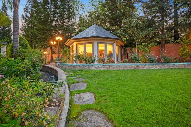 a living room with furniture a rug and a window