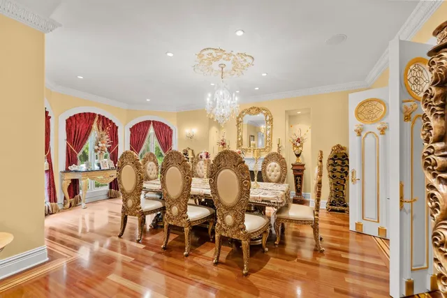 a bathroom with a granite countertop bathtub shower sink vanity and mirror