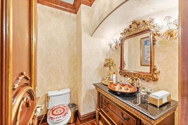 a living room with furniture a fireplace and a large window