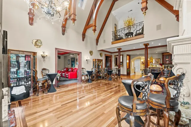 a spacious bathroom with a granite countertop sink a mirror and shower