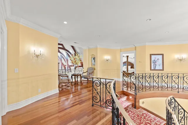 a view of a house with swimming pool and sitting area