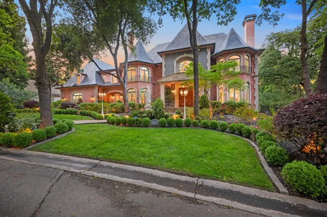 a view of a house with swimming pool and sitting area