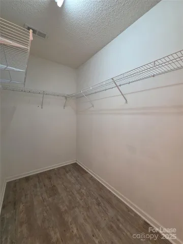 a view of a room with racks on the wall