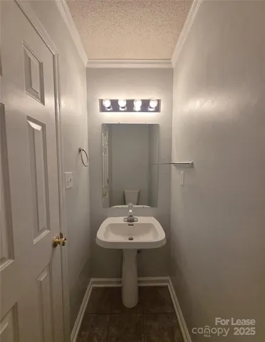 a bathroom with a sink toilet and vanity