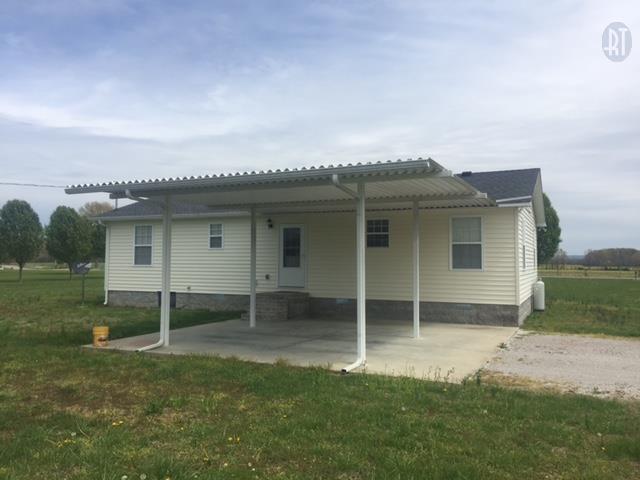 2052 Pete Sain Road Manchester, TN 37355 - Photo 2 of 13 a view of a house with a backyard