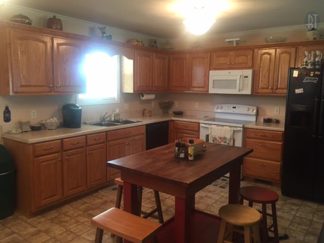 2052 Pete Sain Road Manchester, TN 37355 - Photo 3 of 13 a kitchen with a sink cabinets and wooden floor