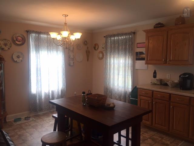2052 Pete Sain Road Manchester, TN 37355 - Photo 4 of 13 a view of a dining room with furniture and chandelier