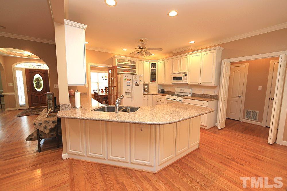 5800 Valley Mist Court Raleigh, NC 27613 - Photo 13 of 30 Hardwood floor, recessed lighting, eat up snack bar