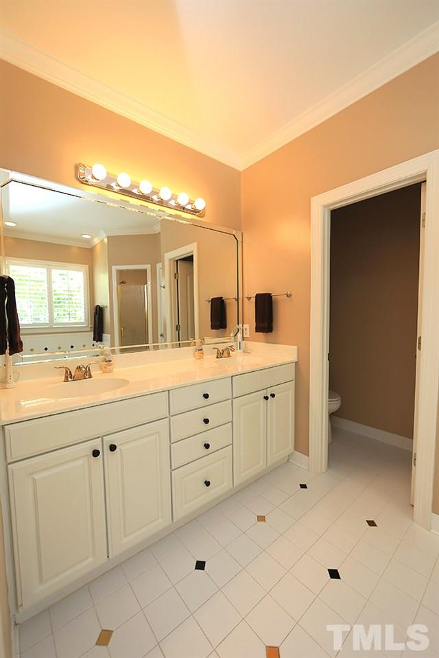 5800 Valley Mist Court Raleigh, NC 27613 - Photo 20 of 30 Ceramic floor, double vanity, large beautiful mirror