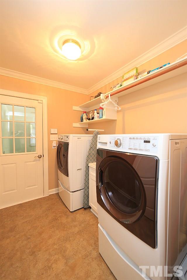 5800 Valley Mist Court Raleigh, NC 27613 - Photo 22 of 30 1st floor for convenience, shelves, new floor and sink /cabinet