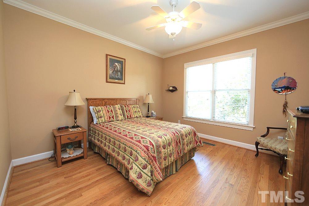 5800 Valley Mist Court Raleigh, NC 27613 - Photo 24 of 30 Hardwood floor, ceiling fan, crown molding
