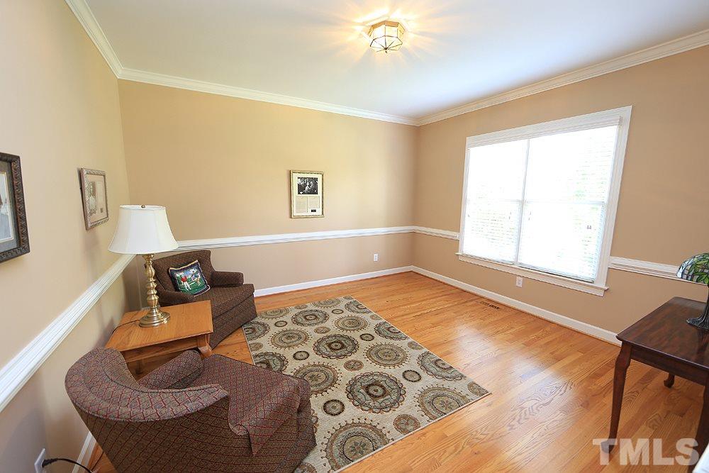 5800 Valley Mist Court Raleigh, NC 27613 - Photo 7 of 30 Hardwood floor, crown molding and chair rail