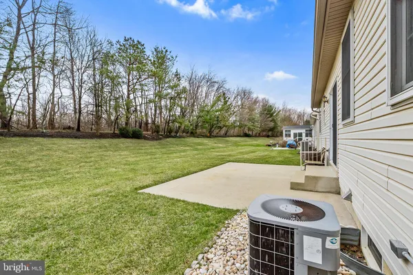 a view of a backyard with sitting area