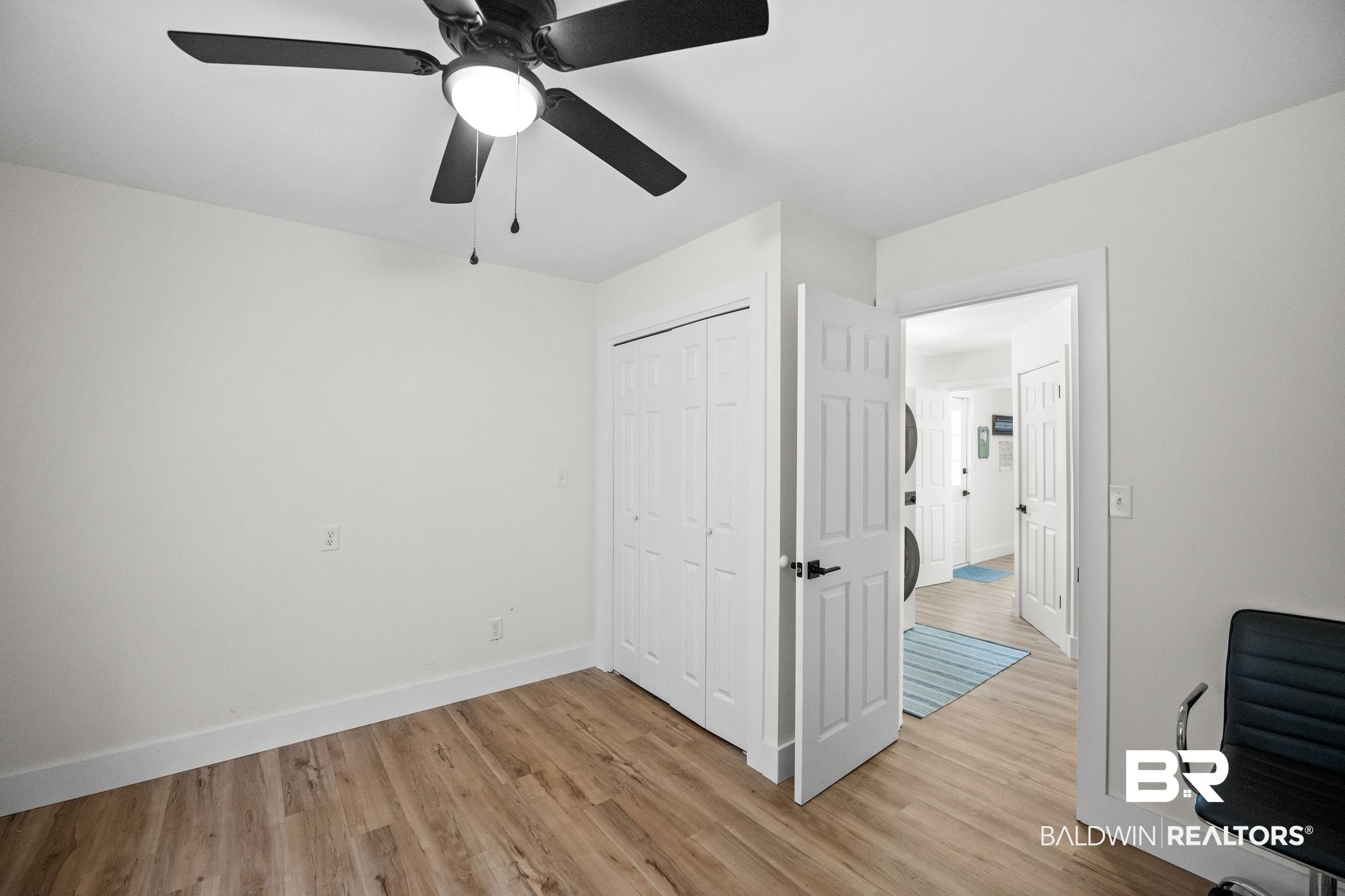 6 Wren Circle Foley, AL 36535 - Photo 28 of 55 Bedroom with light wood-style floors, baseboards, a closet, and ceiling fan
