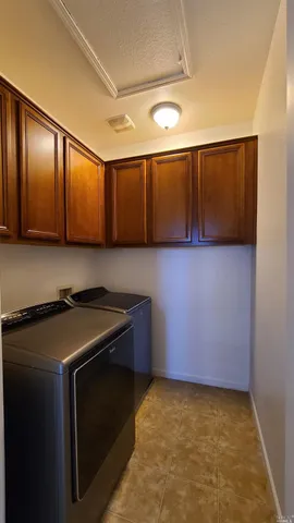 a kitchen with a stove and cabinets