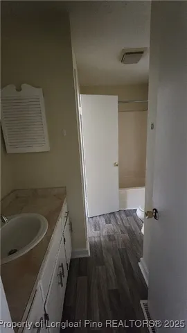 a view of balcony with wooden floor