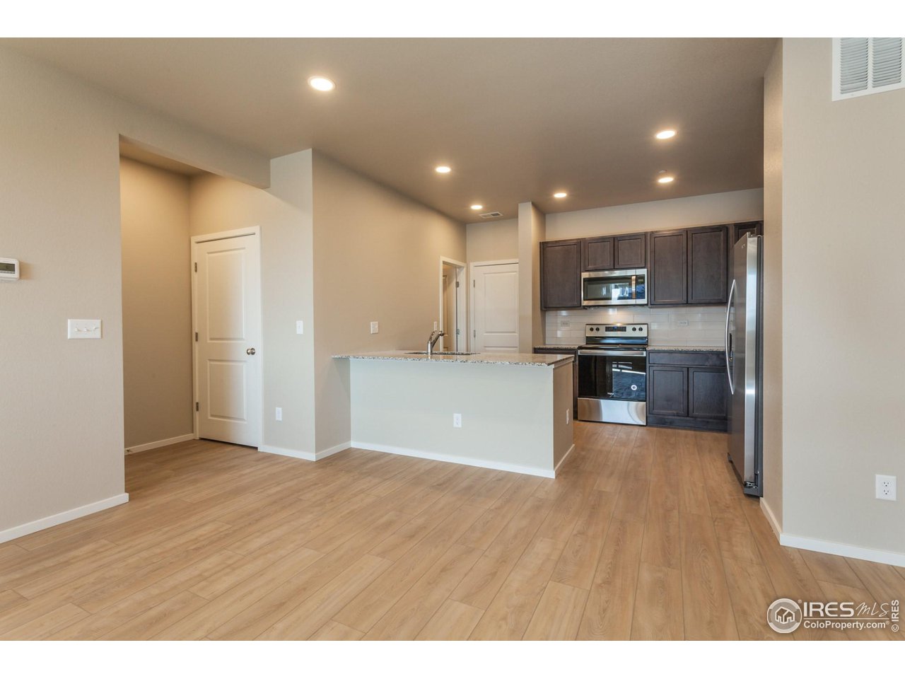6827 4th St Road, Unit 5 Greeley, CO 80634 - Photo 10 of 34 EXMPLE PHOTO: DINING AND LIVING ROOM