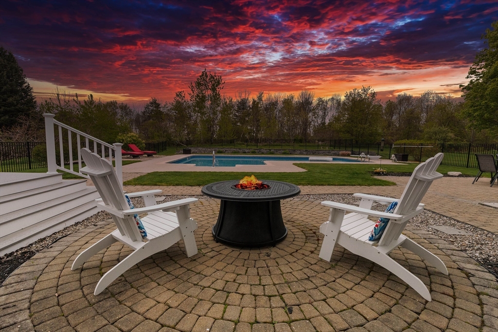24 Spring Hill Road Merrimac, MA 01860 - Photo 5 of 41 a view of a swimming pool with a lounge chair