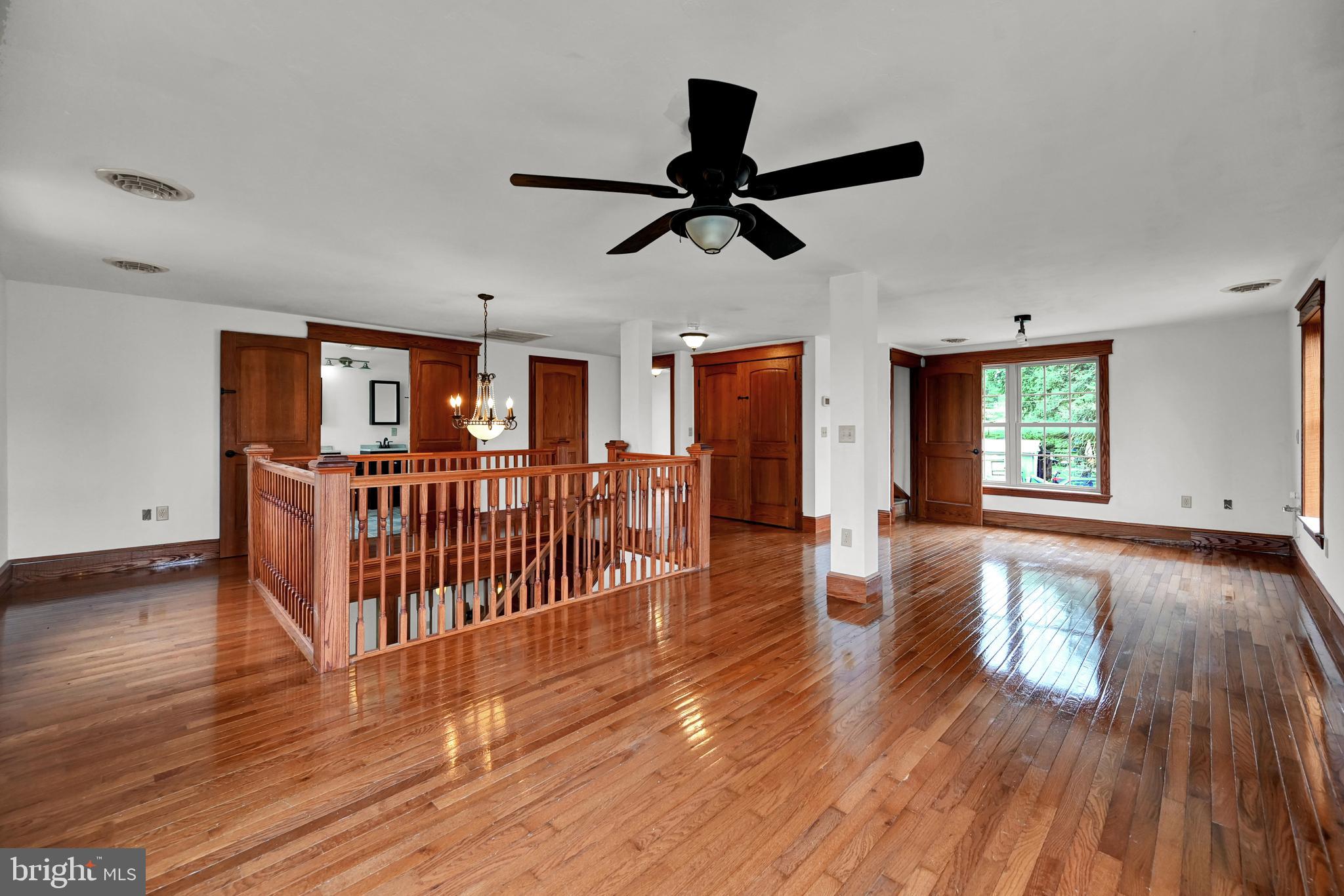 6800 Cannery Road Spring Grove, PA 17362 - Photo 11 of 23 a view of an empty room with wooden floor and windows