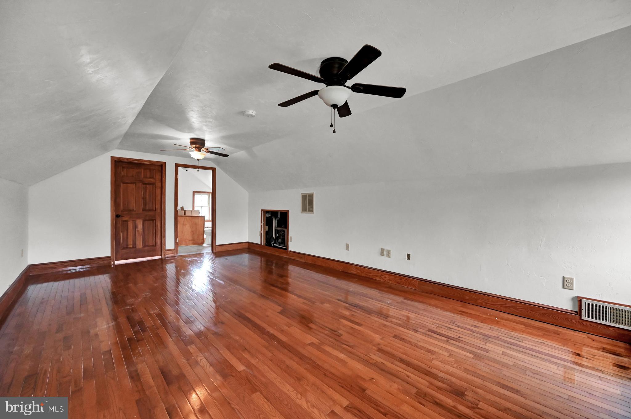 6800 Cannery Road Spring Grove, PA 17362 - Photo 13 of 23 a view of empty room with wooden floor and fan
