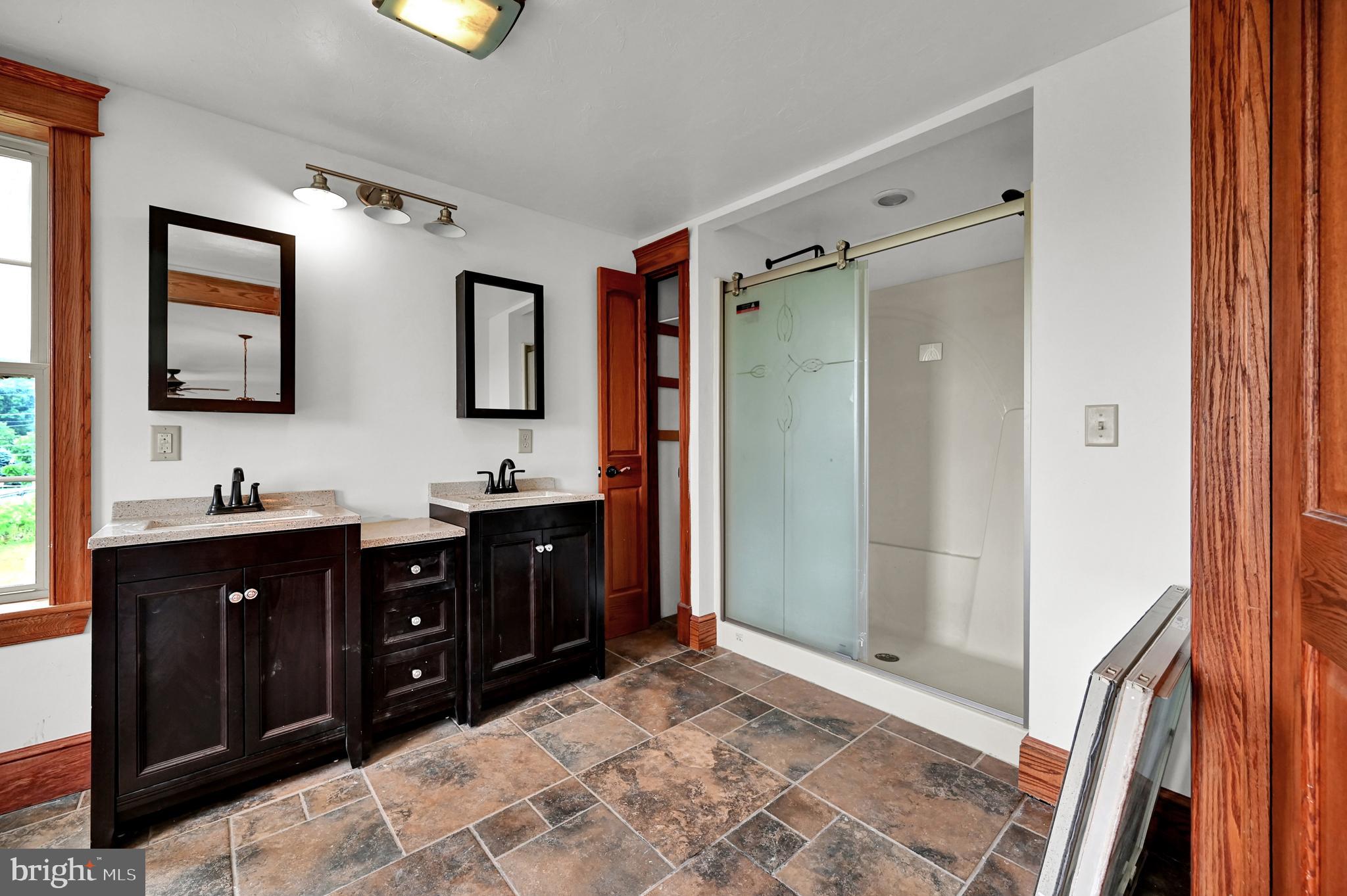 6800 Cannery Road Spring Grove, PA 17362 - Photo 16 of 23 a bathroom with a granite countertop sink a mirror and a shower