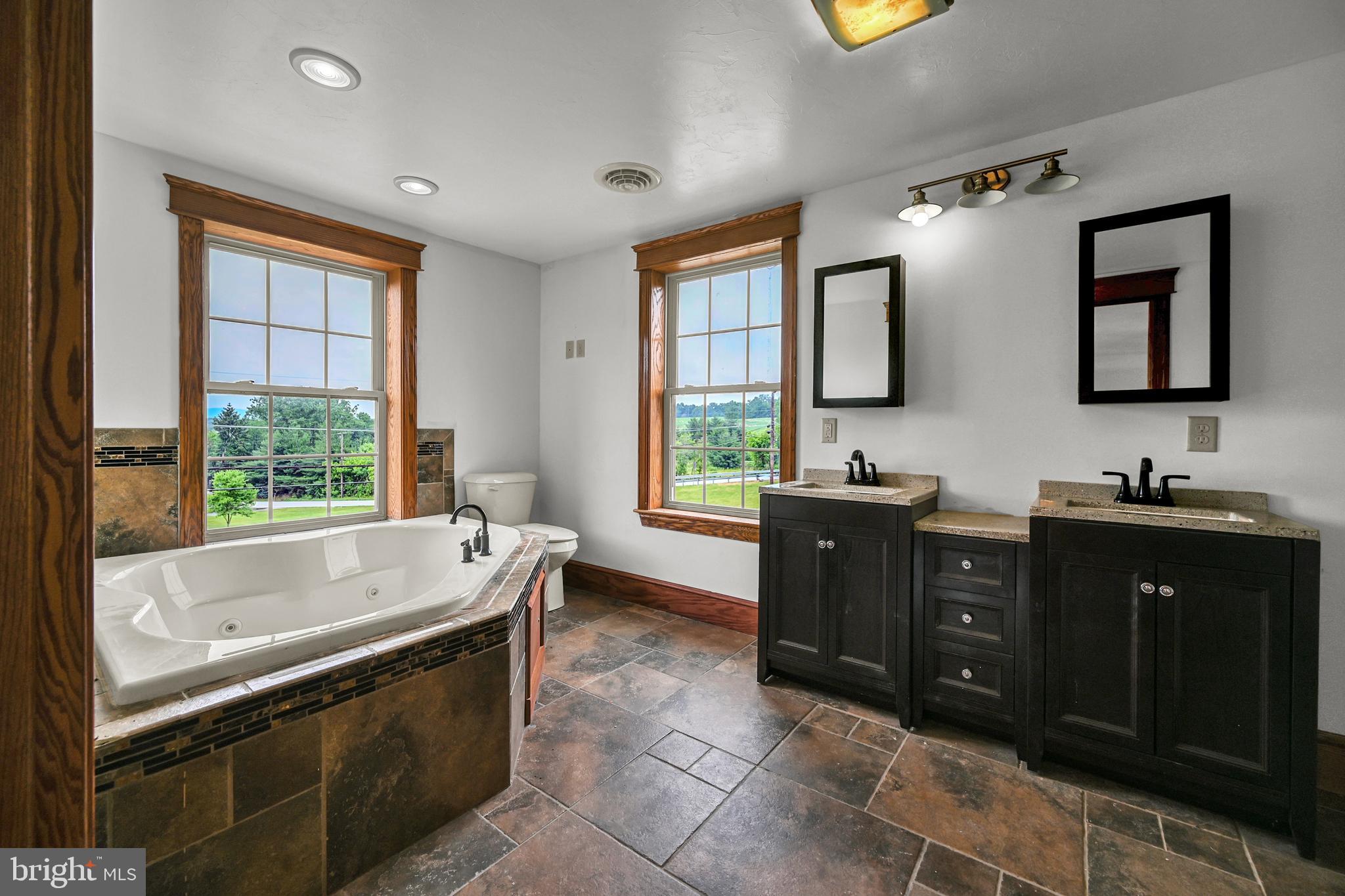 6800 Cannery Road Spring Grove, PA 17362 - Photo 17 of 23 a bathroom with a tub sink and mirror