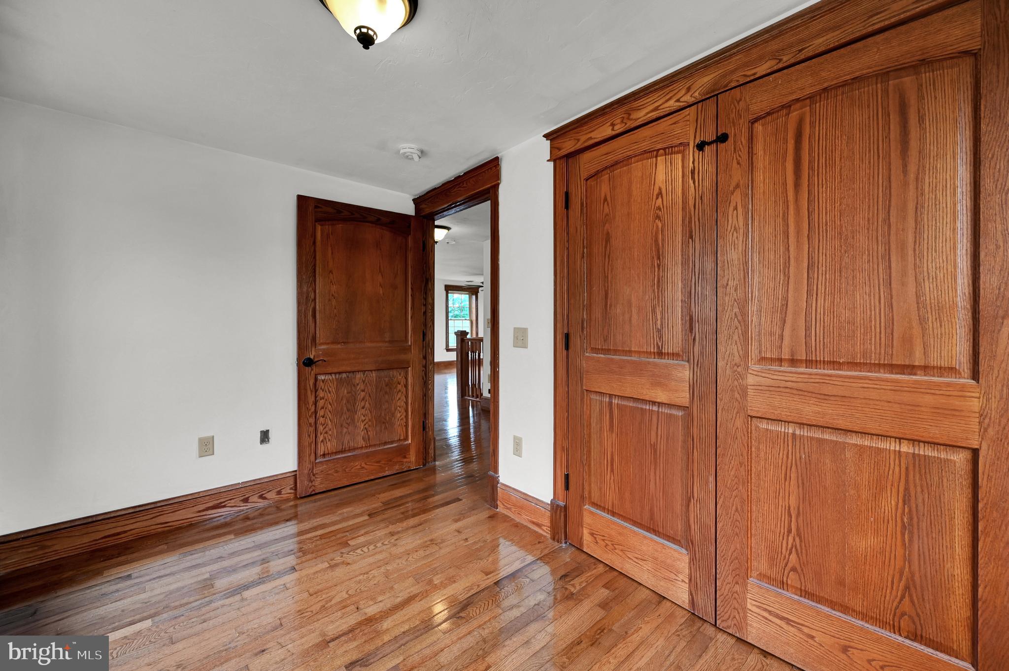 6800 Cannery Road Spring Grove, PA 17362 - Photo 18 of 23 a view of empty room with wooden floor and cabinet