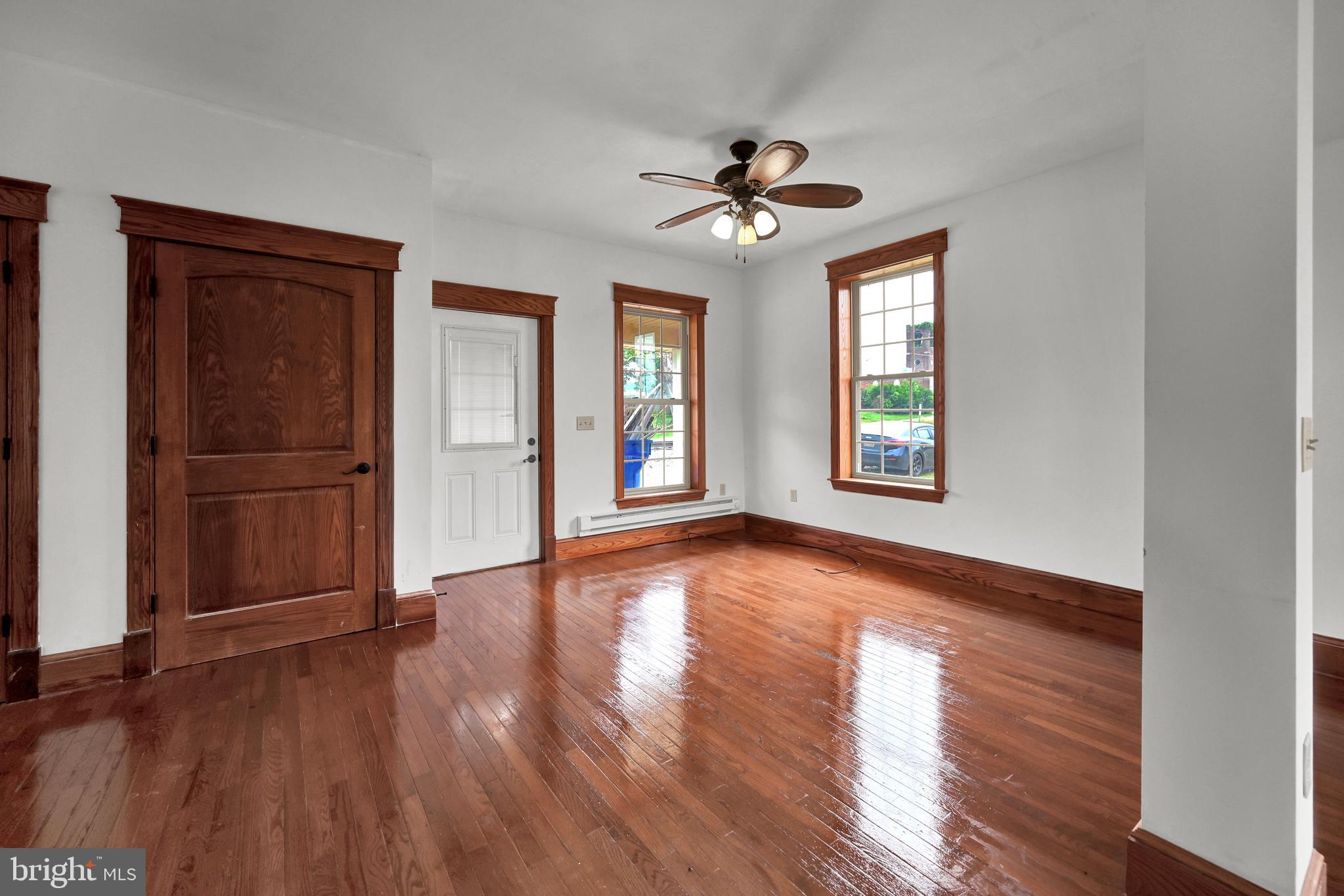 6800 Cannery Road Spring Grove, PA 17362 - Photo 19 of 23 a view of an empty room with wooden floor and a window