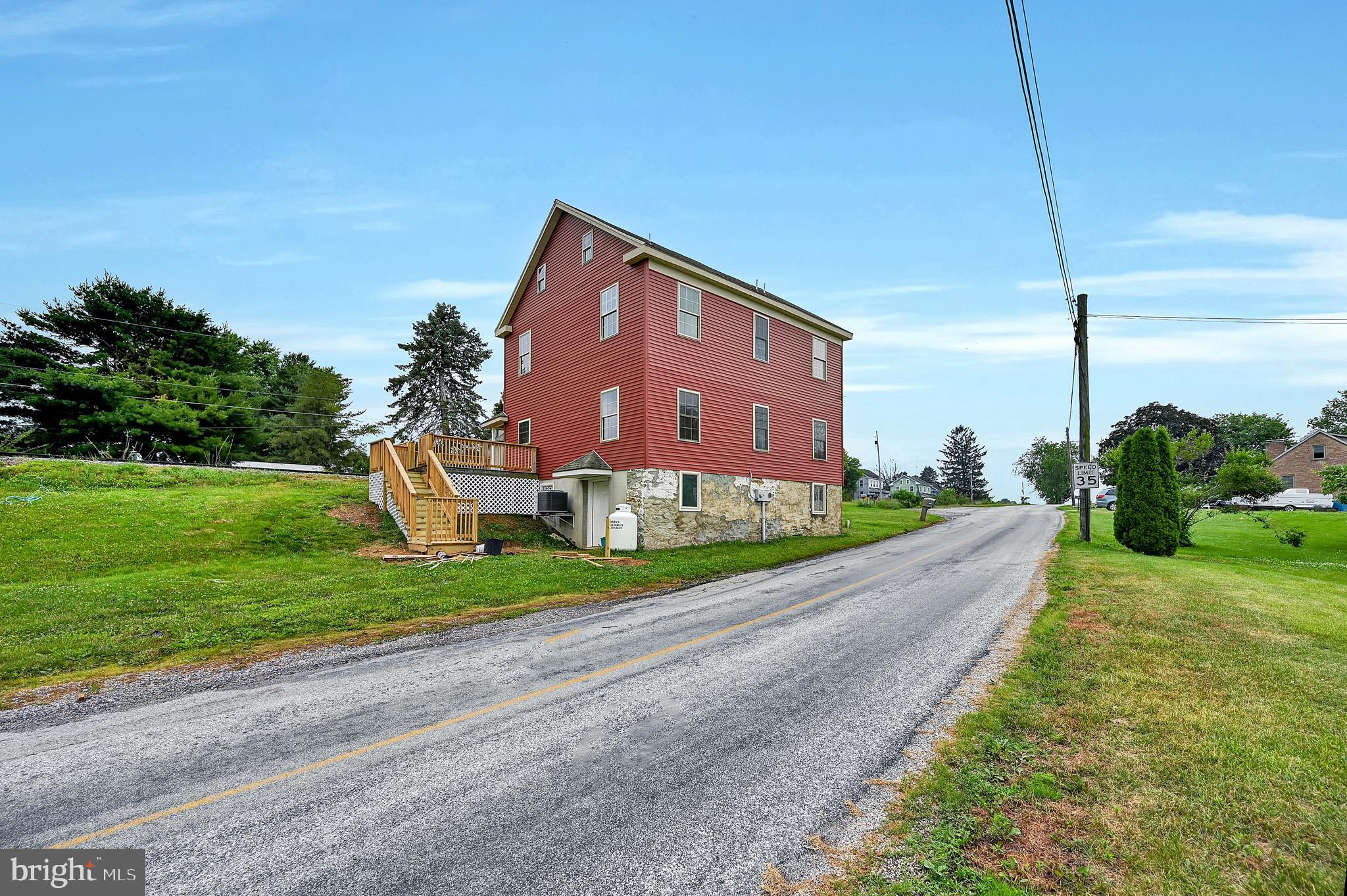 6800 Cannery Road Spring Grove, PA 17362 - Photo 21 of 23 a front view of a house with garden