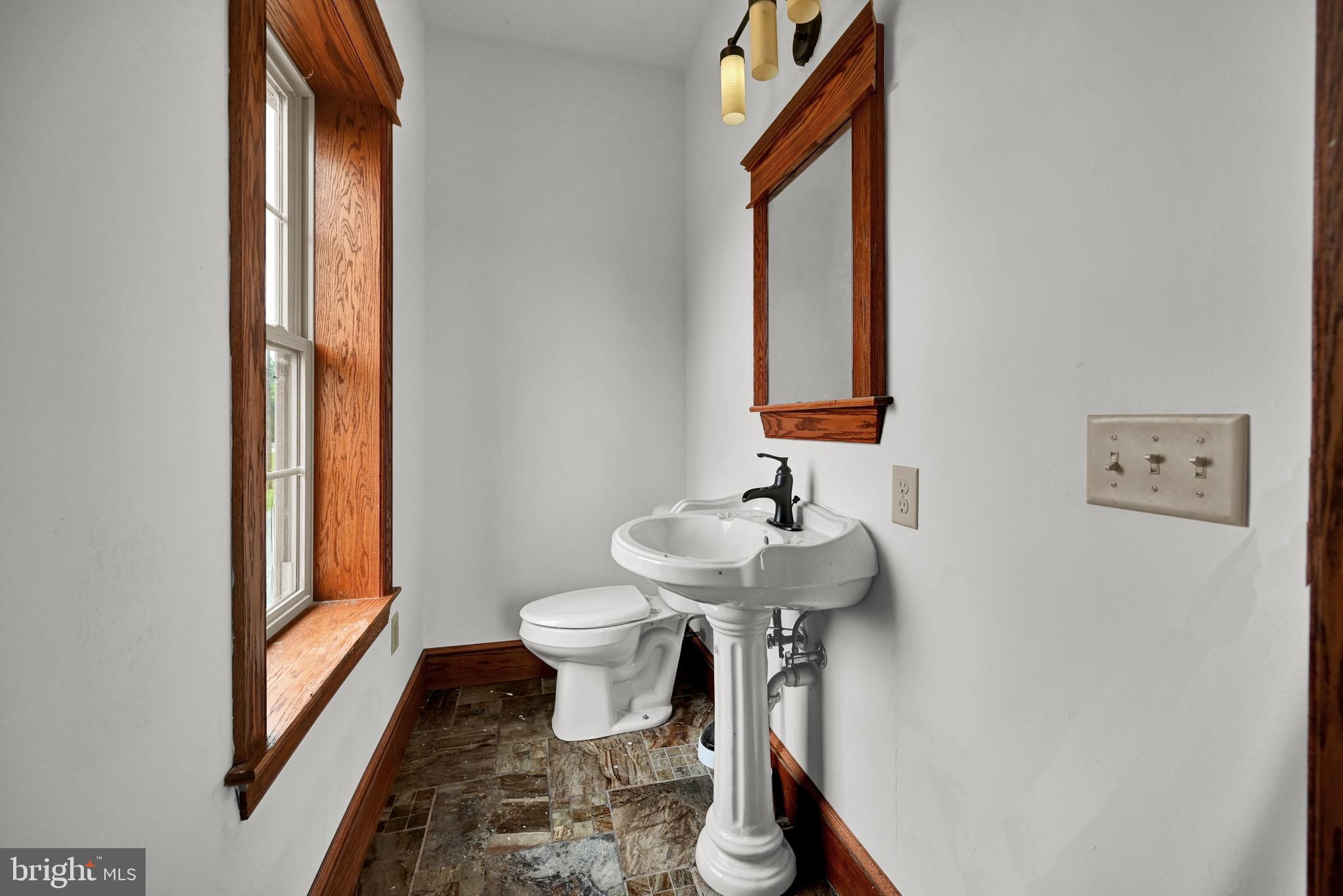 6800 Cannery Road Spring Grove, PA 17362 - Photo 7 of 23 a bathroom with a sink toilet and mirror