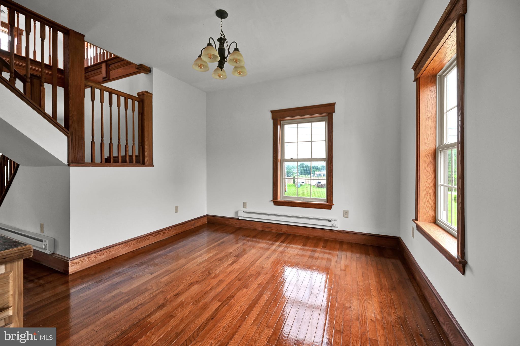 6800 Cannery Road Spring Grove, PA 17362 - Photo 9 of 23 a view of an empty room with wooden floor and a window