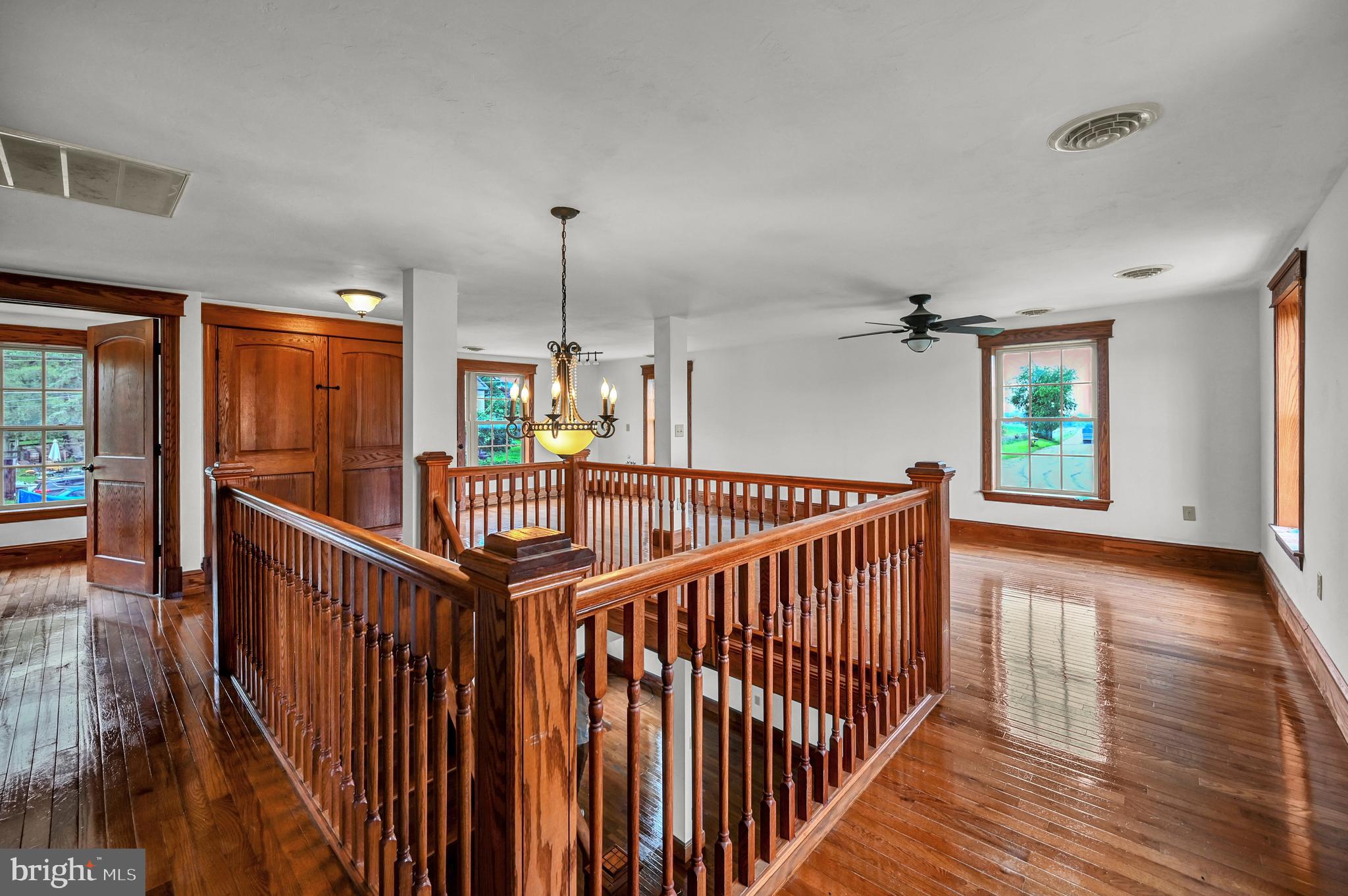 6800 Cannery Road Spring Grove, PA 17362 - Photo 10 of 23 a view of a hallway with wooden floor and stairs