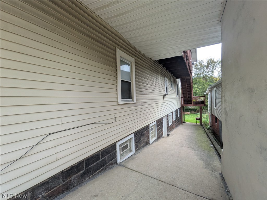 1881 Manchester Road, Unit 1 Akron, OH 44314 - Photo 33 of 44 1881 Manchester Rd, Akron, OH 44314 Unit #1 ground floor access and living. Welcome to this spacious 2-bedroom, 1-bathroom first-floor generous and remodeled apartment in the Kenmore neighborhood of Akron, offering a great amount of comfortable living space. This move-in ready apartment features LVP flooring throughout, a spacious living room, room for dining, separate kitchen with a gas range and stainless steel refrigerator, two bedrooms, and a full private bathroom which has a convenient step-in shower. Large windows provide natural light, while ample closets offer plenty of storage. Enjoy off-street parking and a backyard with a picnic table and small firepit, providing a pleasant outdoor space to relax and enjoy for the buildings tenants.