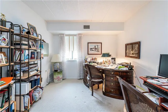 a bathroom with a shower and a glass door