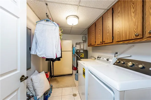a living room with fireplace furniture and a book shelf