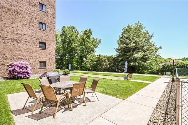 a view of a backyard with a swimming pool