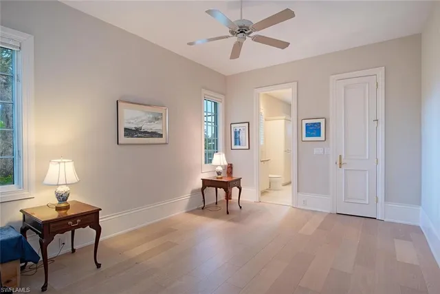 a view of a livingroom with furniture and a window