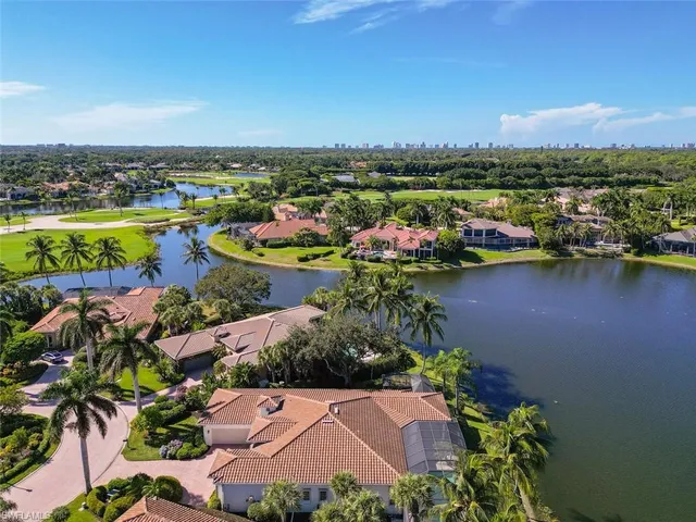 an aerial view of a houses with city view and lake view