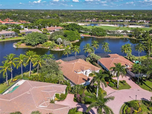 an aerial view of lake residential houses with outdoor space and lake view