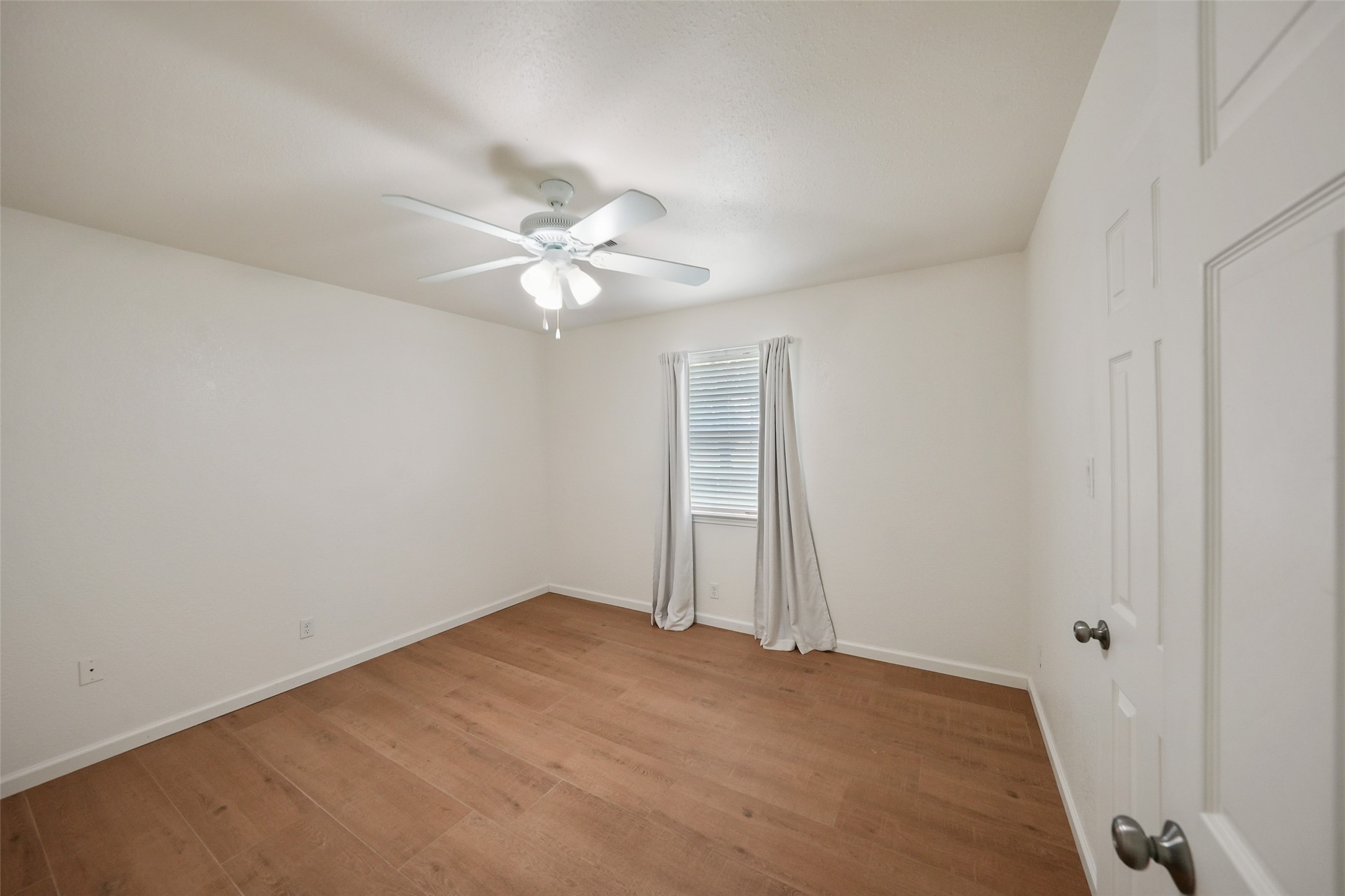 19635 Kermier Road Waller, TX 77484 - Photo 16 of 27 Additional bedroom offering a versatile layout for family, guests, or a home office.