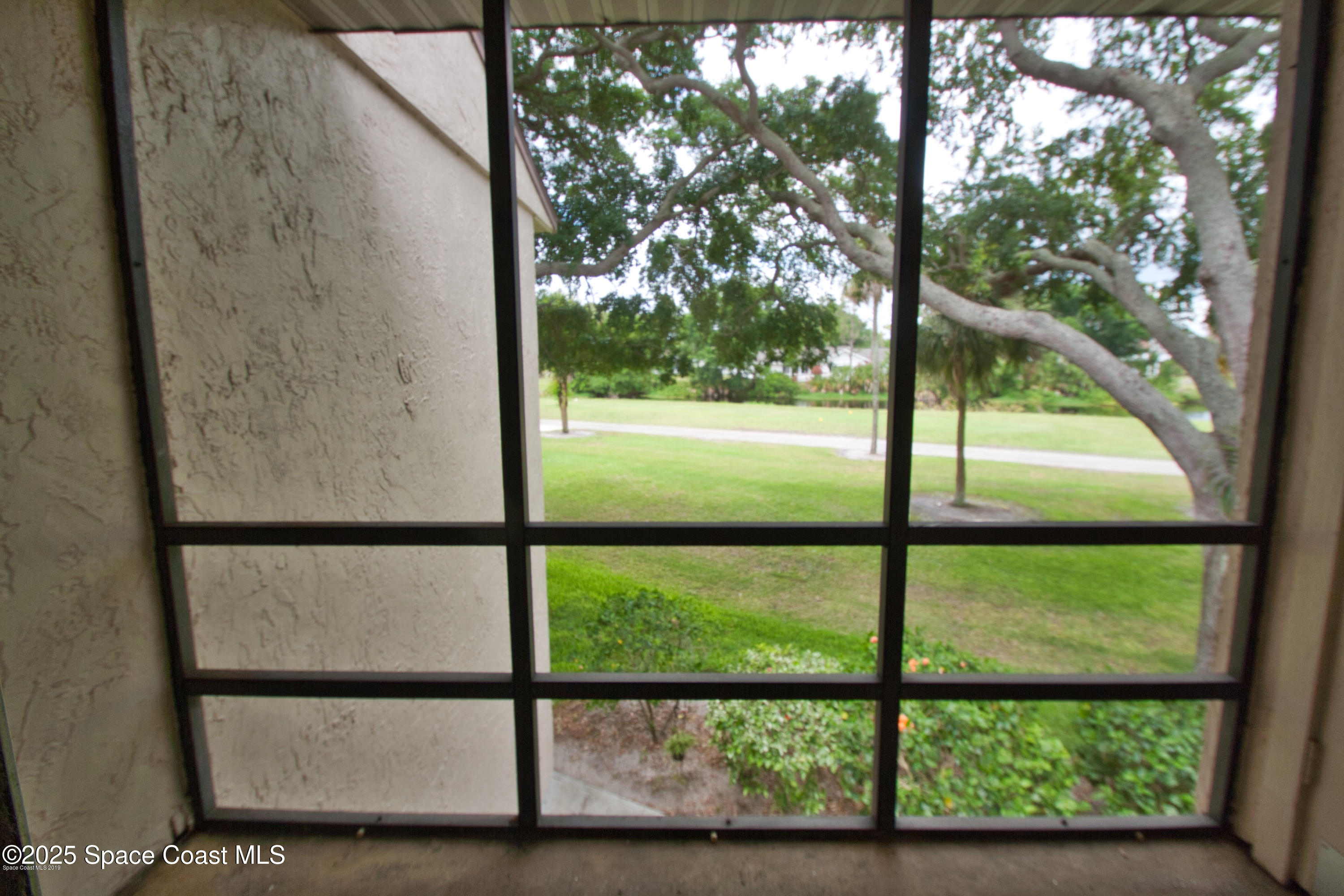 2550 Eagle Drive, Unit 3C Melbourne, FL 32935 - Photo 12 of 14 a view of outdoor from window