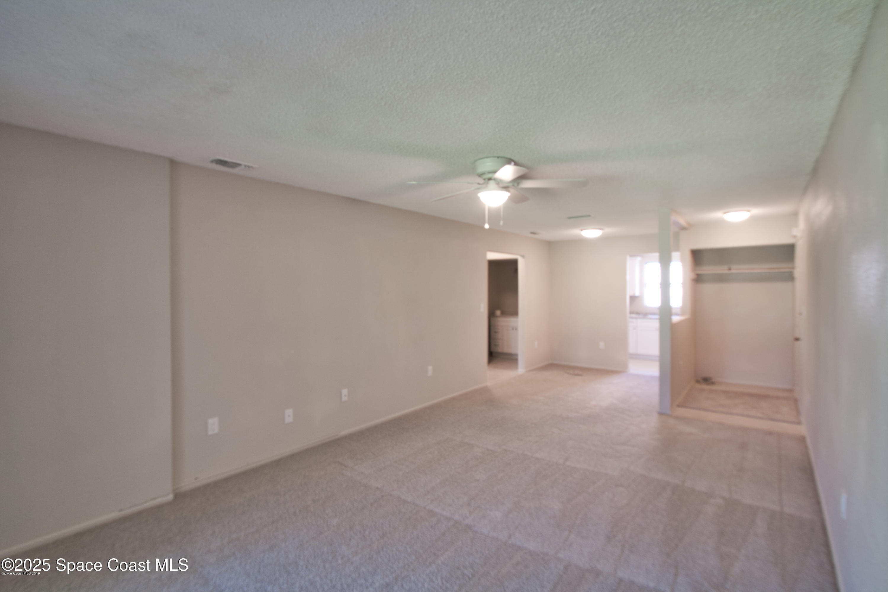 2550 Eagle Drive, Unit 3C Melbourne, FL 32935 - Photo 5 of 14 a view of an empty room