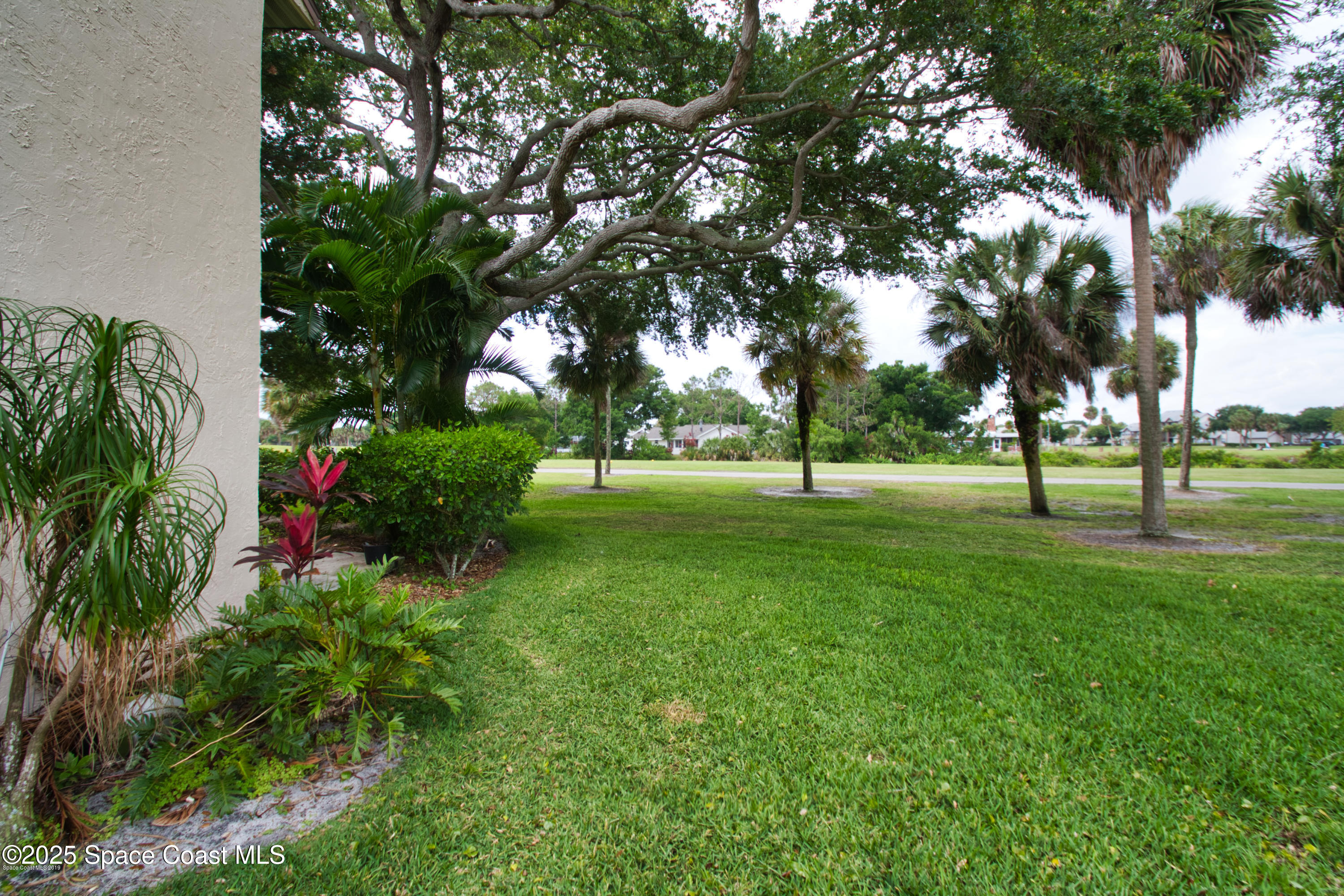 2550 Eagle Drive, Unit 3C Melbourne, FL 32935 - Photo 10 of 14 a view of a park with tree s