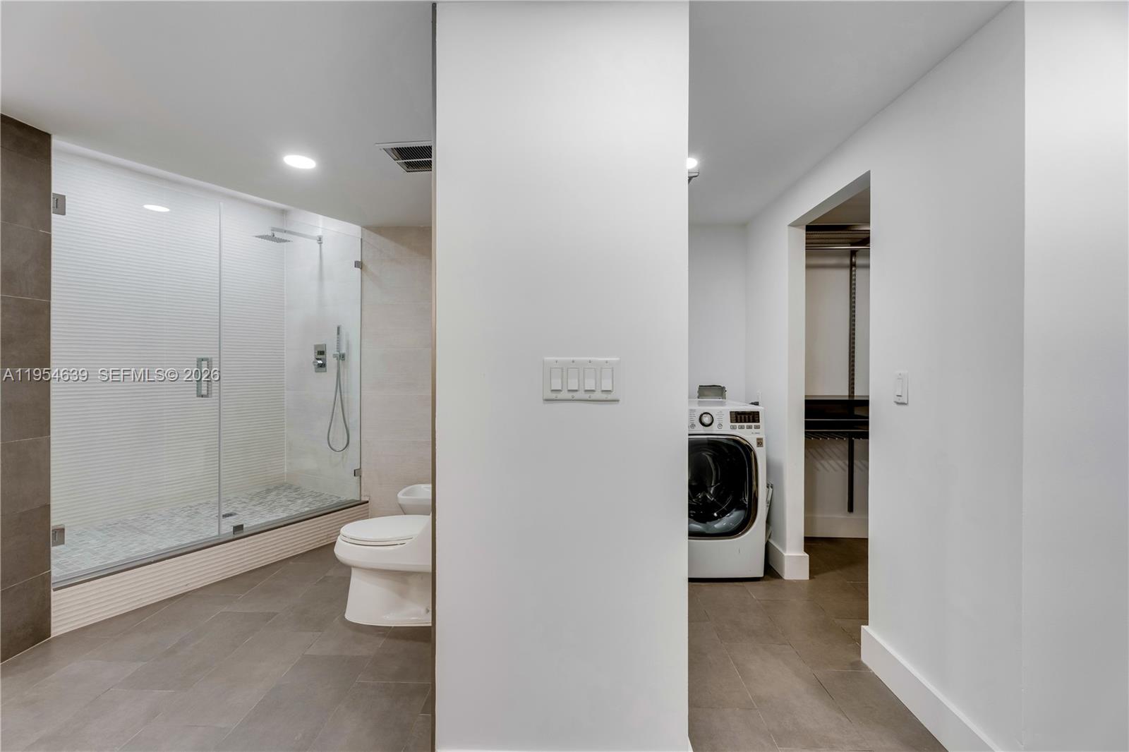 720 Northeast 69th Street, Unit 4S Miami, FL 33138 - Photo 19 of 46 a bathroom with a toilet and a shower