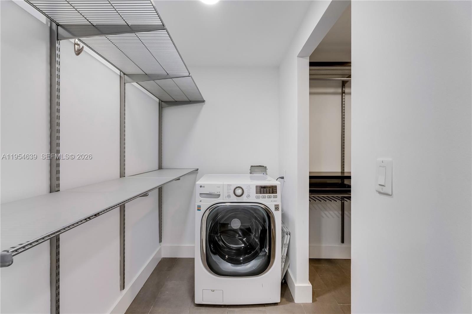 720 Northeast 69th Street, Unit 4S Miami, FL 33138 - Photo 20 of 46 a utility room with dryer and washer