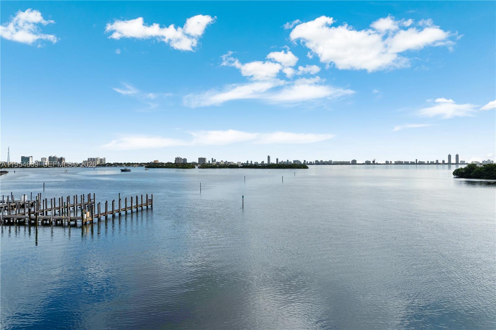 720 Northeast 69th Street, Unit 4S Miami, FL 33138 - Photo 28 of 46 a view of a lake with lawn chairs