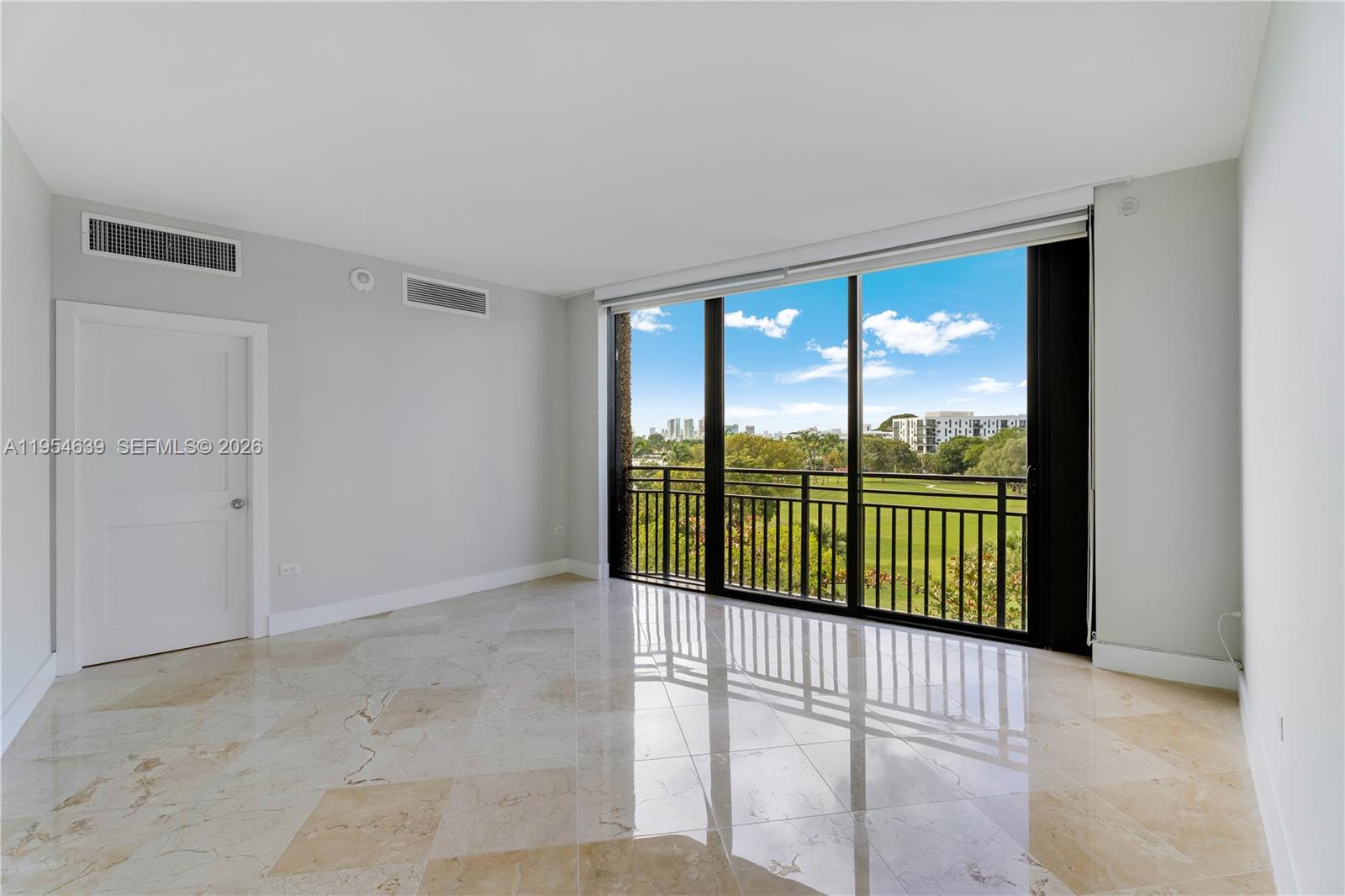 720 Northeast 69th Street, Unit 4S Miami, FL 33138 - Photo 36 of 46 a view of a glass door and an entryway