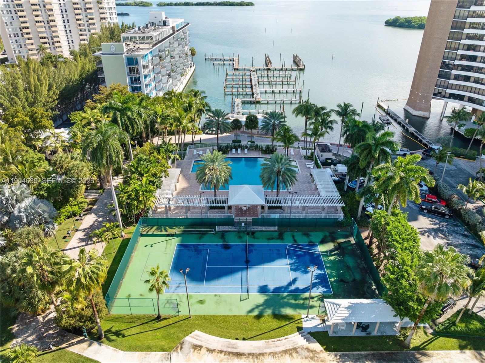 720 Northeast 69th Street, Unit 4S Miami, FL 33138 - Photo 43 of 46 a view of a table and chairs in patio