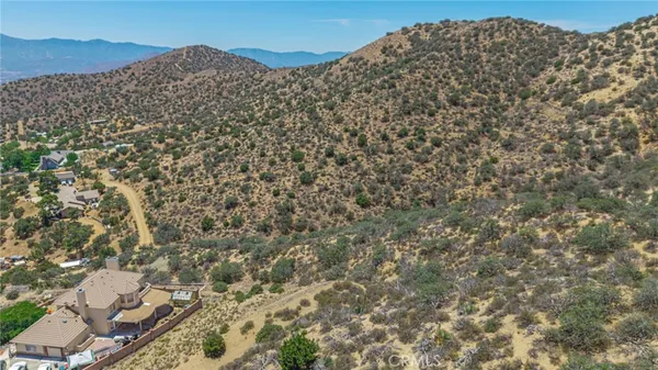 a view of a yard with a mountain