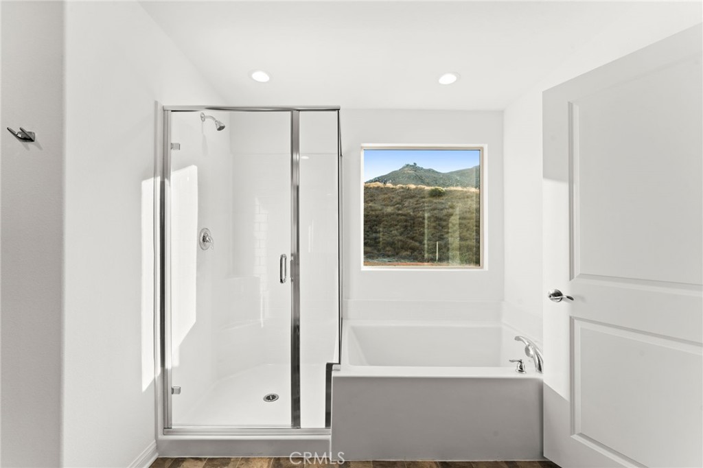 8465 Anthony Street Colton, CA 92324 - Photo 15 of 43 a bathroom with a shower and a tub
